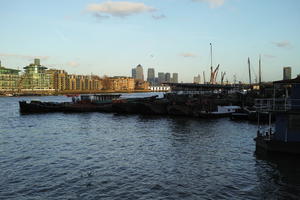 barge, blue, city, city, cityscape, cloud, day, England, eye level view, London, natural light, river, riverbank, sky, sunny, sunset, The United Kingdom, waterfront, winter