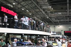 artificial lighting, below, ceiling, crowd, elevated, England, exhibition, interior, London, people, standing, The United Kingdom