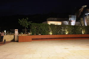 artificial lighting, bench, Bilbao, bush, eye level view, night, Pais Vasco, pavement, Spain, vegetation