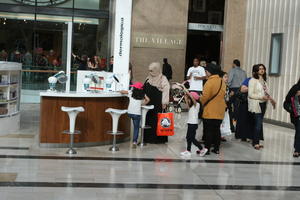 chair, day, England, eye level view, family, furniture, group, indoor lighting, interior, London, mall, middleastern, natural light, people, retail, shop, shopping, shopping centre, The United Kingdom, walking