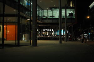 artificial lighting, building, England, eye level view, London, night, office, pavement, restaurant, spring, street, The United Kingdom, urban, walkway