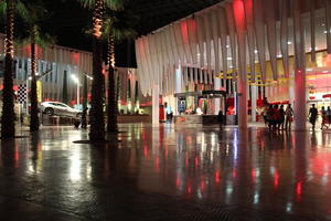 building, Dubai, Dubayy, entrance, eye level view, night, outdoor lighting, palm, people, plant, plaza, square, The United Arab Emirates, walking, walkway