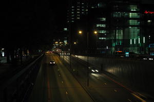 artificial lighting, building, car lights, city lights, England, eye level view, London, night, spring, street, The United Kingdom, tower, traffic, tunnel, urban