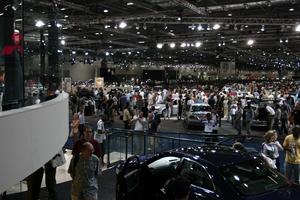 artificial lighting, casual, ceiling, crowd, elevated, England, exhibition, interior, London, people, standing, The United Kingdom