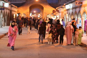 arabic, artificial lighting, autumn, child, crowd, Essaouira, eye level view, family, market, Morocco, people, street, walking, woman