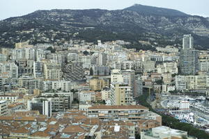 afternoon, building, cityscape, cliffs, cloudy, day, elevated, facade, looking down, Monaco, Monte Carlo, Monte-Carlo, mountain, overcast, sun glare, top-down perspective, winter