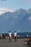 afrocarribean, back, day, eye level view, Lausanne, mountain, natural light, people, quay, summer, sunny, Switzerland, Vaud, walking