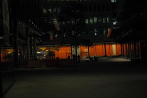 artificial lighting, building, courtyard, England, eye level view, lobby, London, night, pavement, spring, The United Kingdom, urban