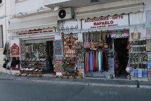 Agios Nikolaos, autumn, bag, clothing, day, eye level view, Greece, jewellery, Lasithi, object, retail, sign, souvenir, street