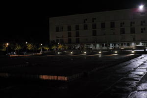 artificial lighting, building, city, Croatia, eye level view, night, pavement, pavement, paving, plaza, spring, treeline, wet, Zadar, Zadarska