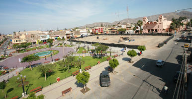 building, car, day, elevated, Ica, lamppost, natural light, Nazca, park, Peru, street, sunny, town, tree, vegetation