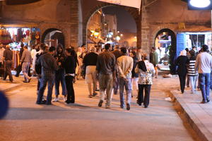 arabic, artificial lighting, autumn, crowd, Essaouira, eye level view, group, man, market, Morocco, night, people