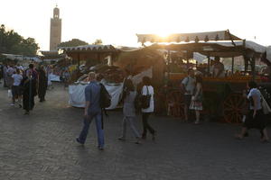 autumn, dusk, eye level view, group, market, Marrakech, Marrakesh, middleastern, Morocco, people, stall, tourist