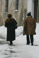 ambient light, couple, day, eye level view, Italia , man, Mondovi, old, overcast, people, Piemonte, snow, street, walking, winter, winter, woman