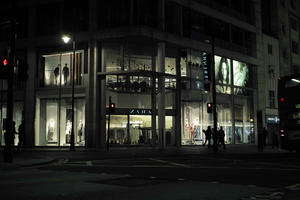 artificial lighting, England, eye level view, London, night, outdoor lighting, retail, shop, street, The United Kingdom