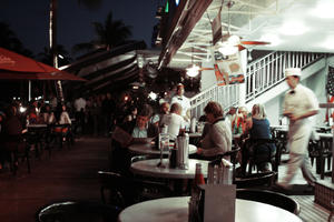 artificial lighting, chair, eye level view, Florida, furniture, group, Miami, night, object, people, restaurant, sitting, table, The United States, waiter