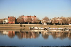 afternoon, boat, bright, building, day, England, eye level view, London, river, The United Kingdom, transport, tree, vegetation, wall, winter, winter