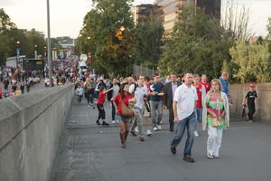 child, couple, crowd, dusk, England, eye level view, London, people, stadium, The United Kingdom, woman