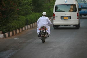 back, day, East Timor, Egypt, Egypt, eye level view, man, middleastern, motorcycling, natural light, street, van