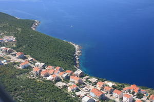 above, aerial view, bright, day, greenery, island, looking down, shore, summer, sunny, village