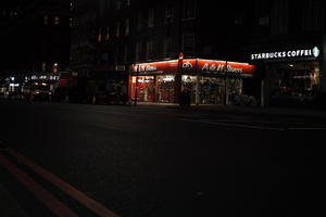 artificial lighting, city, city lights, England, eye level view, London, night, outdoor lighting, retail, shopfronts, street, The United Kingdom, urban