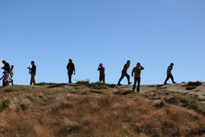 below, day, grass, group, hill, people, summer, sunlight, sunny, sunshine, tourist