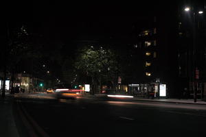 artificial lighting, car lights, city lights, England, eye level view, London, night, spring, street, The United Kingdom, traffic, urban