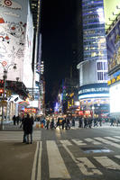 artificial lighting, city, crossing, crowd, eye level view, New York, New York, night, outdoor lighting, people, street, The United States, urban, walking, winter