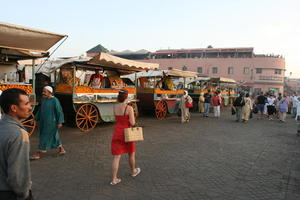 autumn, dusk, eye level view, group, market, Marrakech, Marrakesh, middleastern, Morocco, people, square, stall, tourist, woman