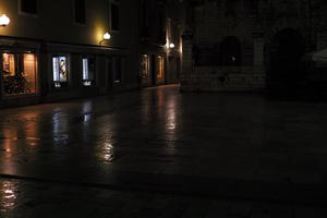 artificial lighting, building, city, Croatia, eye level view, night, pavement, pavement, paving, plaza, spring, wet, Zadar, Zadarska