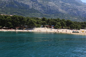 beach, coastline, Croatia, day, eye level view, Makarska, people, seascape, Splitsko-Dalmatinska, summer, sunbathing, tree, vegetation, woodland