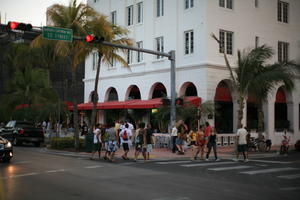 building, cafe, canopy, crowd, dusk, eye level view, facade, Florida, Miami, palm, people, street, summer, The United States, tree, vegetation, walking, winter