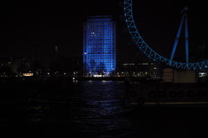 artificial lighting, city, city, city lights, cityscape, England, eye level view, ferris wheel, London, London eye, night, river, riverbank, spring, The United Kingdom, tower, urban