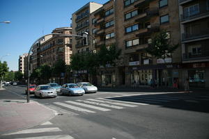 architecture, car, Castilla y Leon, day, eye level view, retail, road, Salamanca, Spain, summer, sunlight, sunny, sunshine, transport