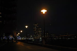 artificial lighting, city, city, city lights, cityscape, embankment, England, evening, eye level view, London, pavement, pavement, promenade, sidewalk, street light, The United Kingdom, winter