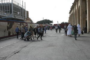 autumn, day, eye level view, group, Malta, Malta, natural light, nun, people, street, walking