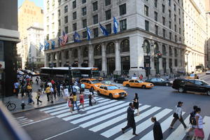 afrocarribean, building, car, crossing, day, elevated, flag, latino, man, Manhattan, New York, people, standing, street, summer, sunny, taxi, The United States, walking, woman