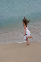 autumn, beach, day, diffuse, diffused light, elevated, girl, Malta, natural light, running, side