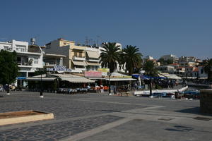 Agios Nikolaos, autumn, day, eye level view, Greece, Lasithi, object, palm, plaza, restaurant, sign, tropical, vegetation