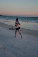 beach, eye level view, Florida, running, Sarasota, seascape, sunny, sunset, sunshine, The United States, winter, woman