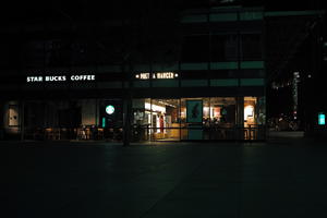 artificial lighting, building, cafe, England, eye level view, London, night, pavement, spring, The United Kingdom, urban, walkway