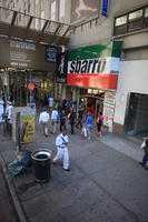 advertisement, afrocarribean, business, day, elevated, man, Manhattan, New York, people, retail, shop, standing, street, summer, sunny, The United States, walking