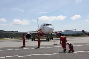 airplane, airport, autumn, cloudy, day, eye level view, Malaysia, Malaysia, man, natural light, people, walking