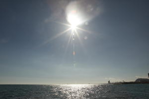 autumn, Barcelona, bright, Cataluña, clear, day, eye level view, reflected, seascape, sky, Spain, sun, sun glare, sunny, water, waves