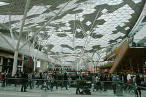 ceiling, day, England, eye level view, group, indoor lighting, interior, London, mall, natural light, people, shopping, shopping centre, The United Kingdom, walking