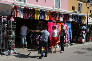 clothing, couple, Croatia, day, display, eye level view, Istarska, market, natural light, object, people, shopping, spring, stall, street, summer, sunny, tourist