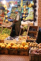 arabic, artificial lighting, autumn, Essaouira, eye level view, food, man, market, Morocco, object, stall, vendor