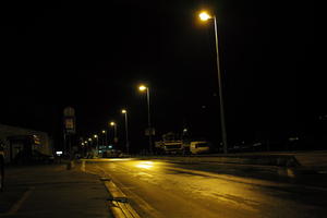 artificial lighting, city, Croatia, eye level view, night, pavement, sidewalk, spring, street, street light, wet, Zadar, Zadarska