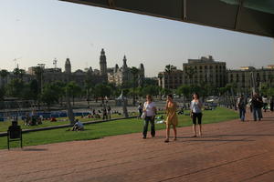 Barcelona, building, Cataluña, day, eye level view, group, park, pavement, people, Spain, summer, sunny, tree, vegetation, walking, woman