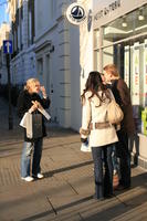 afternoon, casual, day, England, eye level view, group, London, natural light, people, street, The United Kingdom, walking, winter, winter, woman